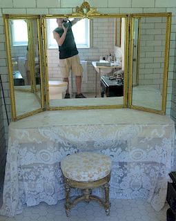 Two piece lot to include a trifold gilt mirror and a revolving vanity stool. 
mirror: height 42 inches, center panel width 32 inches...