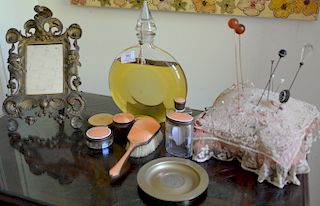 Large round Guerlain perfume bottle, five enameled dresser pieces, hat pins, and Victorian framed mirror. 
perfume: height 11 3/4 in...