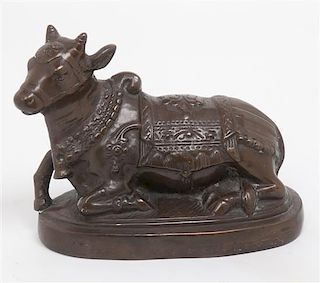 A Bronze Figure of a Bull, Length 8 1/2 inches.