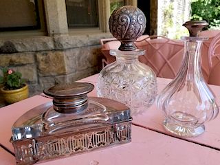 Three sterling and crystal pieces to include a cut glass decanter with sterling stopper, inkwell, and a small bottle