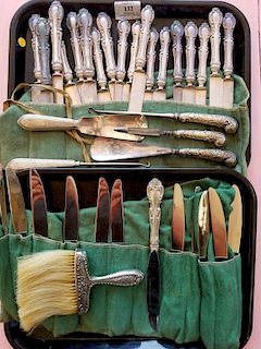 Large group of weighted sterling silver to include set of 18 knives, 12 knives, 2 piece dresser set, 3 piece dresser set, and 3 brushes