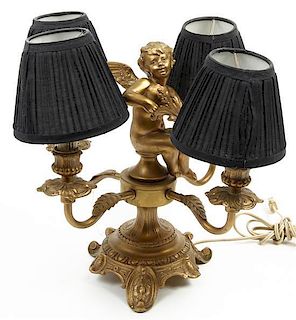 A Neoclassical Gilt Metal Four-Light Candelabrum, Height 12 1/4 inches.