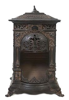 A Victorian Style Wrought Iron Stove, Height 37 x width 24 1/4 x depth 23 inches.