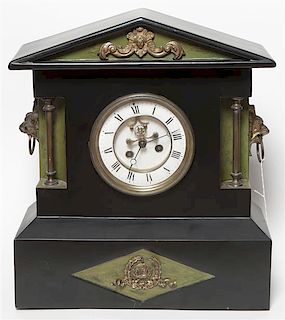 An Ebonized Pediment Clock, Height 16 1/4 inches.