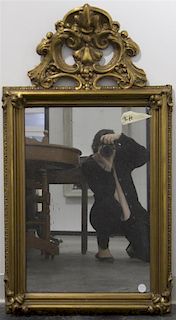 A Baroque Style Giltwood Mirror, Height 38 x width 21 inches.