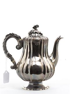A George IV Silver Teapot, William Eley II, London, 1826, Height 9 1/4 inches.