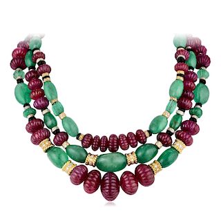 A Ruby Emerald Onyx and Diamond Three-Strand Necklace