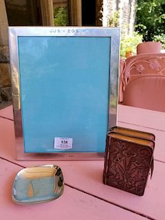 Three piece silver group to include Tiffany sterling frame, small Tiffany sterling dish, and a silver book cover.  