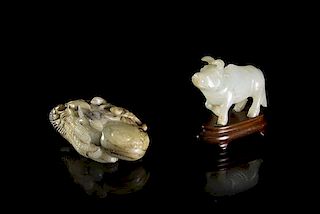 A Carved Celadon and Russet Jade Three-Legged Toad, Width of wider 3 1/2 inches.