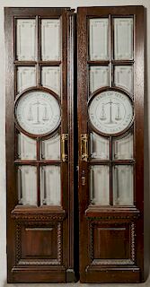 Pair of Custom Made Carved Oak Doors, 20th c., made for a law office, with mullioned glazed etched panes around etched center panels with the scales o