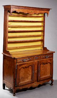 French Louis XV Style Carved Inlaid Cherry Vaisselier, 19th c., the arched apron with urn form finials, above four plate racks, on a canted corner bas
