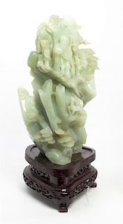 A Carved Green Hardstone Mountainscape, Height 22 inches.