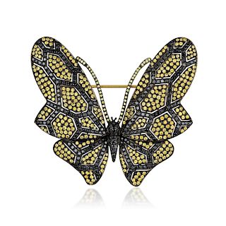 An 18K Gold Black Diamond and Yellow Sapphire Butterfly Brooch
