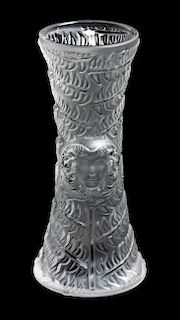 * A Lalique Molded and Frosted Glass Vase Height 7 1/4 inches.
