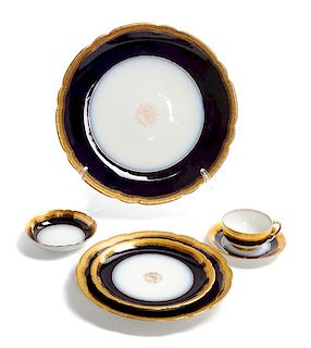 * A Partial French Porcelain Dinner Service Diameter of first 9 3/4 inches.