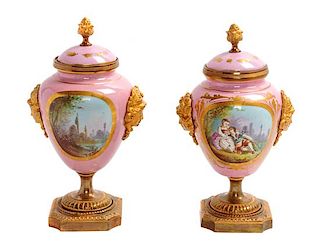 * A Pair of Sevres Lidded Urns Height 8 inches.
