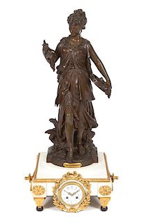 * A French Bronze and Gilt Metal Figural Clock Height 28 1/2 inches.
