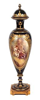 * A Royal Vienna Style Porcelain Lidded Urn Height 33 inches.