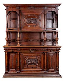 A German Carved Buffet Deux Corps Height 89 x width 70 x depth 24 inches.
