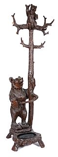 * A German Carved Figural Umbrella Stand Height 79 1/2 inches.
