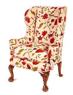 An Upholstered Wingback Chair Height 45 inches.