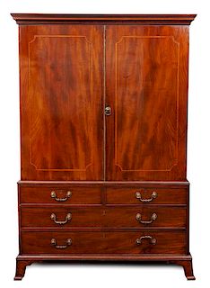 A George III Style Linen Press Height 75 1/2 x width 50 x depth 24 3/4 inches.