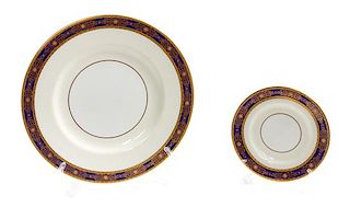 * A Set of English Porcelain Dinner Plates and Saucers Diameter of dinner plate 10 1/2 inches.