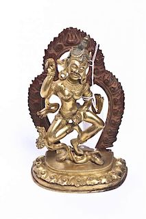 A Tibetan Gilt Bronze Figure, Height overall 6 7/8 inches.