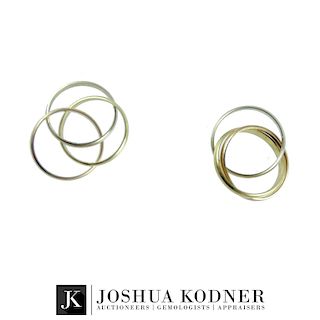 (2) Two 18K Cartier Band Rings.