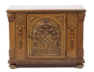 A Renaissance Revival Style Carved Walnut Side Cabinet Height 33 1/4 x width 44 x depth 19 inches.