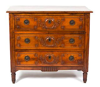 A French Provincial Carved Fruitwood Chest of Drawers Height 37 x width 41 x depth 23 inches.