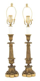 A Pair of Louis XV Style Patinated Gilt Bronze Candlesticks Height of candlestick 13 7/8 inches.