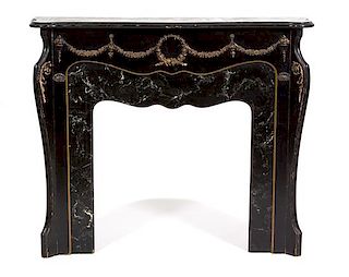 A Louis XV Style Ebonized Wood and Faux Marble Fire Place Surround Height 44 1/2 x width 52 1/4 x depth 12 1/2 inches.
