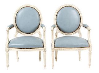 A Pair of Louis XVI Style Carved and Painted Oval Back Fauteuils Height 35 inches.