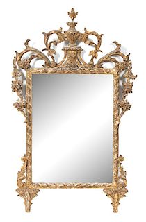 A Louis XVI Style Carved Giltwood Mirror Height 41 1/2 x width 25 1/4 inches.