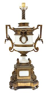 A Louis XVI Style Gilt Bronze Mounted White Ceramic Urn-form Lamp Height to bulb 28 x width 13 x depth 10 inches.