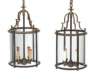 A Pair of French Brass and Glass Circular Hall Lanterns Height 21 x diameter 11 inches.