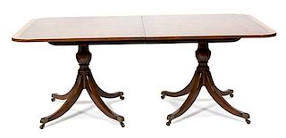 A Regency Style Mahogany Two-Pedestal Dining Table Height 29 1/2 x length 78 x depth 48 inches.