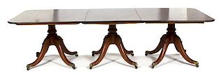 A Regency Style Double Pedestal Dining Table Height 28 x width (open) 107 x depth 48 inches.