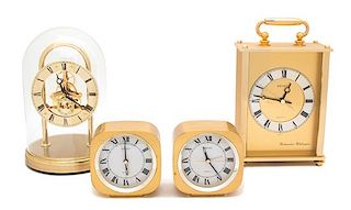 A Collection of Four Seiko Brass Quartz Clocks Height of tallest 9 3/4 inches.