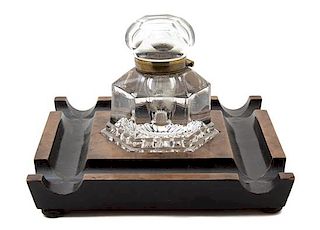 An English Walnut, Parcel Ebonized and Cut Glass Inkwell Height 6 3/4 x 10 1/4 inches square.