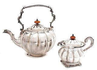 A Silvered Metal Teapot and Creamer, ,