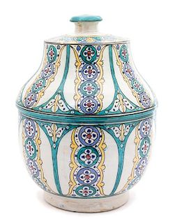 A Middle Eastern Glazed Ceramic Covered Jar Height 15 3/4 inches.