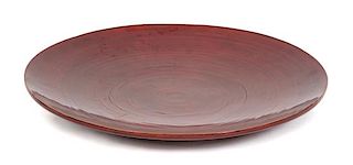 An Asian Red Lacquer Charger Diameter 21 3/4 inches.