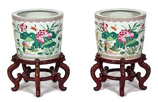 A Pair of Chinese Export Famille Rose Porcelain Jardinieres Height 12 x diameter 14 1/4 inches.