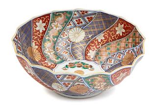 A Japanese Imari Porcelain Bowl Height 4 x diameter 9 3/4 inches.