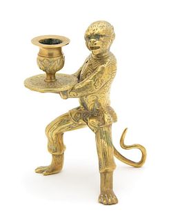 A Brass Monkey-Form Candlestick Height 6 1/2 inches.