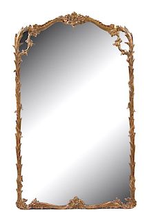 A Foliate Carved Giltwood Framed Mirror Height 53 x width 33 inches.