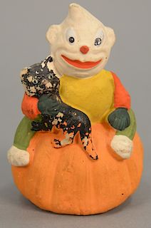 Vintage Halloween paper mache candy container of a figure sitting on a pumpkin holding a black cat, marked on bottom Germany. ht. 4 ...