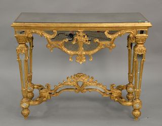 Continental style gilt console table with inset mirrors. ht. 36 in., top: 20" x 45"